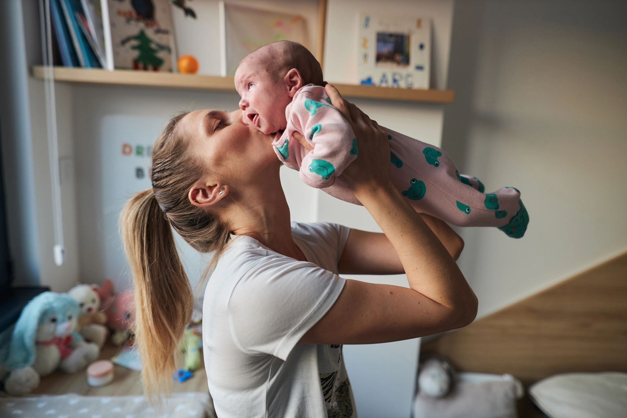 Mother holding a newborn in a peaceful home setting