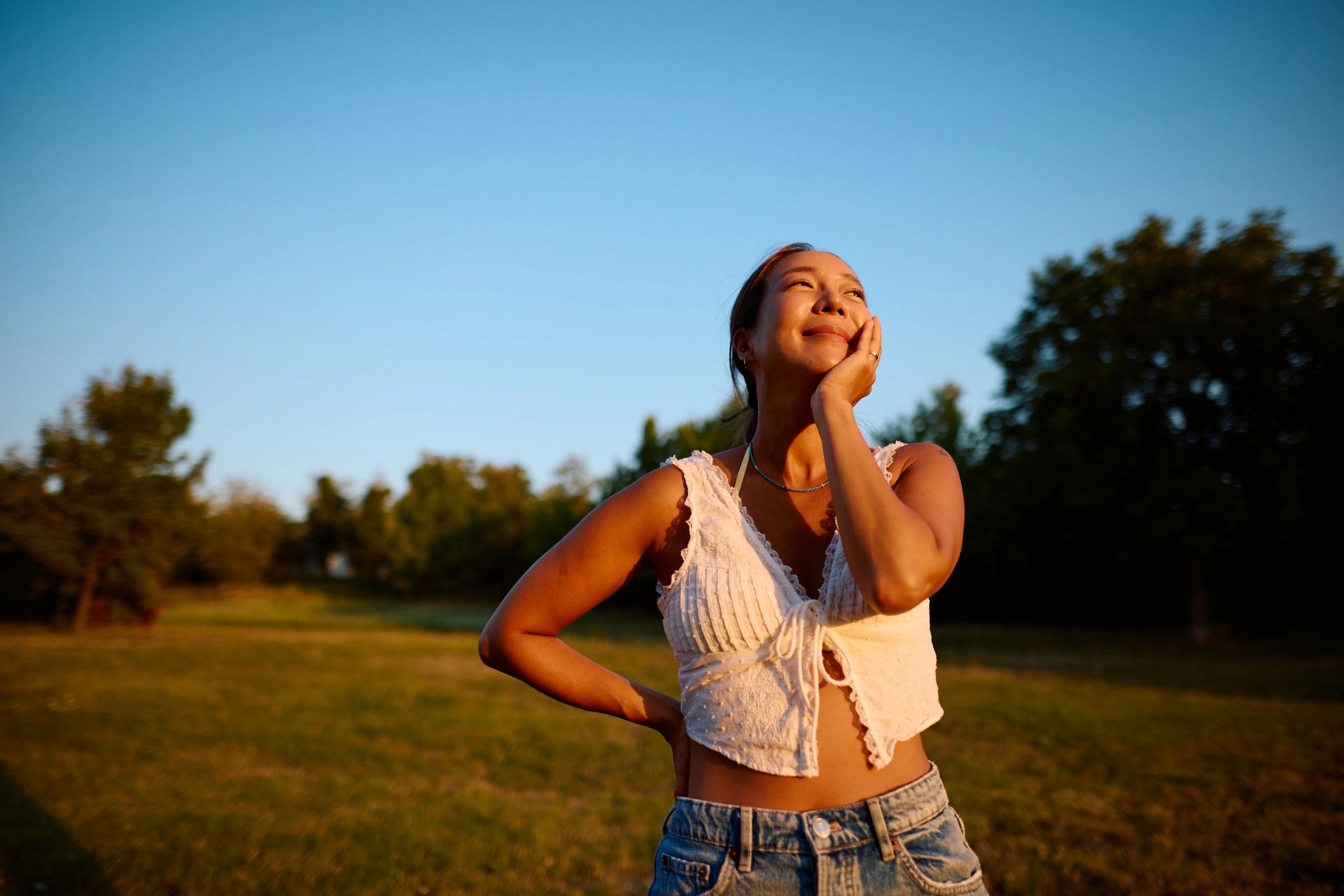 Woman enjoying peaceful sunlight outdoors